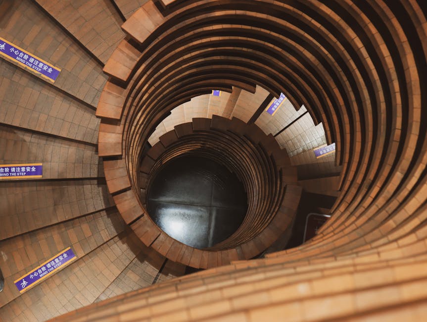 Mesmerizing spiral staircase with unique architecture viewed from above.